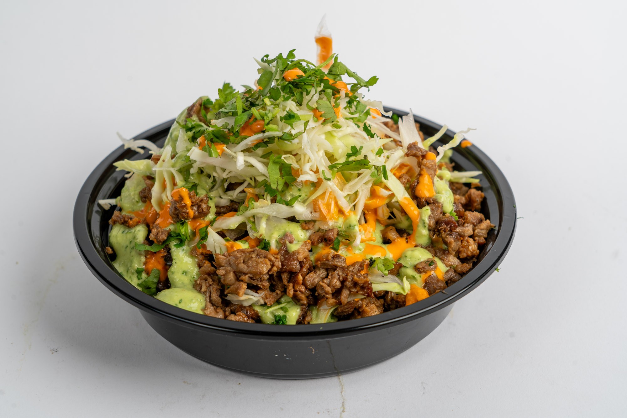 Mexican rice bowl with beans meat and fresh toppings
